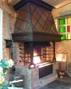 an old fashioned brick fireplace in a home