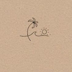 a drawing of a palm tree and the sun on a piece of brown paper with black ink