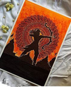 an orange and black card with a silhouette of a woman holding a bow on it