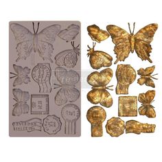 some gold butterflies and stamps on a white background