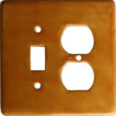 a light switch cover with two holes in the front and one on the back side