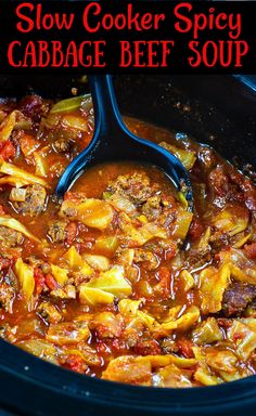 slow cooker spicy cabbage beef soup in a crock pot with the title above it