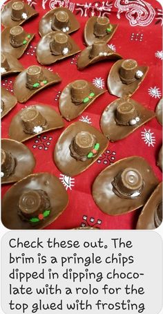 some chocolate covered spoons sitting on top of a red tablecloth with white and green decorations