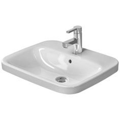 a white bathroom sink with chrome faucet and soap dispenser