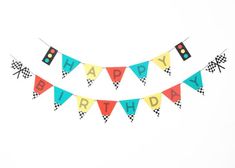 a birthday banner with cars and race flags