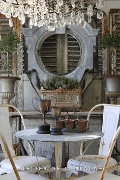 an old fashioned table and chairs in a room