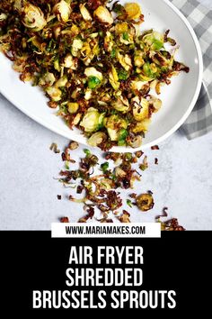 an air fryer shredded brussels sprouts on a white plate