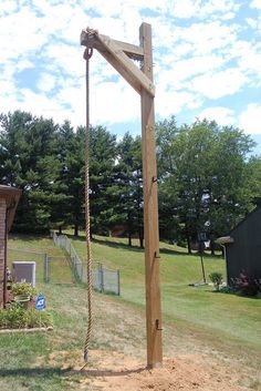 a wooden cross in the middle of a field