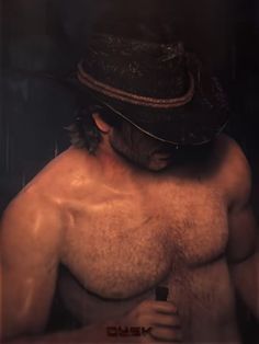 a shirtless man wearing a cowboy hat