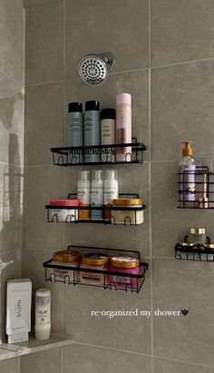 the shelves in the shower are filled with personal care items