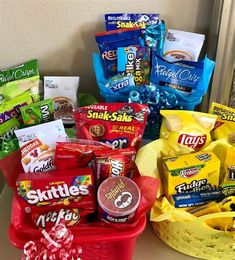 a basket filled with candy and snacks sitting on top of a counter