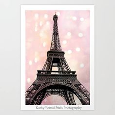 the eiffel tower in paris, france with pink and white lights behind it