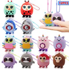 an assortment of cute little monsters with teeth and eyes on them, all in different colors