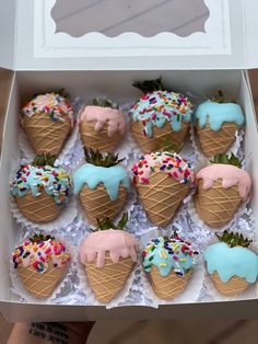 a box filled with ice cream covered in sprinkles