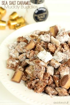 sea salt caramel muddy buddies recipe on a white plate with gold foiled candies