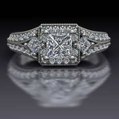 a diamond engagement ring with an intricate design