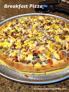 a pizza sitting on top of a metal pan