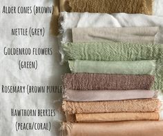 towels stacked on top of each other in different colors and sizes, labeled with names