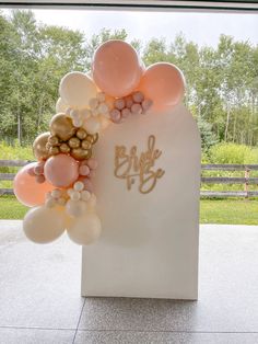 balloons and confetti decorate the entrance to a bride's day celebration at their home