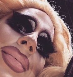 a close up of a person with makeup on