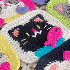 crocheted cat coasters are laying on top of each other in different colors