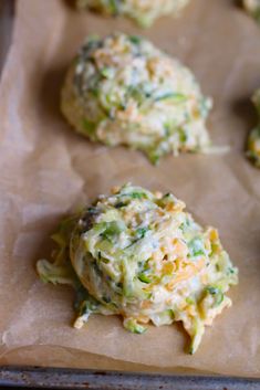 broccoli and cheese cookies are sitting on a baking sheet, ready to go into the oven