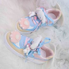 Step into a world of whimsy and charm with these enchanting sneakers that seamlessly blend playful kawaii aesthetics with unique design elements. The upper of the sneakers features adorable plush kitty claw embellishments, adding a touch of cute and cuddly flair to your every step. At the heel, angel wing decorations gracefully extend, giving an ethereal feel to the sneakers and making you feel as if you're walking on clouds. To top off this delightful design, the sneakers come adorned with Cinn Cute Multicolor Low-top Sneakers, Cinnamonroll Sanrio Shoes, Kawaii Shoes Cinnamoroll, Cute High-top Sneakers With Cartoon Print, Kawaii Sneakers Pastel, Harajuku Style Pink Synthetic Sneakers, White Kawaii Sneakers With Synthetic Material, Harajuku Princess Shoes, Claw Gloves