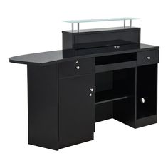 a black desk with a glass top and drawers on one side, an open shelf to the other