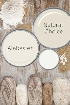 several balls of yarn sitting next to each other on top of a wooden table with the words natural choice