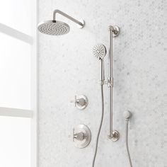 the shower head and handset are shown in this bathroom