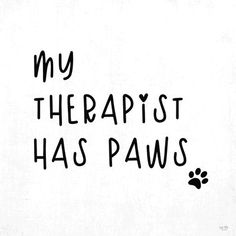 a black and white photo with the words my therapy has paws on it's side