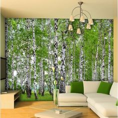 the living room is decorated with green and white wallpaper, along with a large mural of birch trees