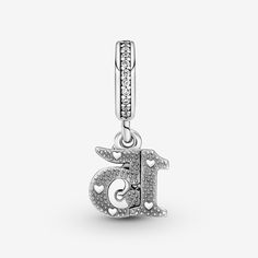 Celebrate a sweet 15th birthday with the 15th Birthday Dangle Charm. Hand-finished in sterling silver, this charm includes the number 15 with a polished front and back with micro beads and heart-shaped bead details, plus a small crown-shaped dangle with pavé on the front and pavé on the bail. Inspired by Quinceañera, the celebration of a 15-year-old girl's birthday rooted in Spanish and indigenous cultures, this charm is a sweet and stylish way to mark the moment. - Pandora 15th Birthday Dangle Micro Beads, Number 15, Bracelet Pandora, Pandora Bracelet Charms, Custom Pendants, 15th Birthday, Dangle Charms, Pandora Bracelet, Love Bracelets