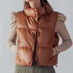 Camel Color Faux Leather Puffer Vest Long Puffy Coat, Faux Leather Puffer Vest, Leather Puffer Vest, Tna Super Puff, Orange Puffer Jacket, Leather Puffer, Super Puff, Hooded Winter Coat, Puffy Coat