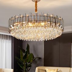 a chandelier hanging from the ceiling in a living room