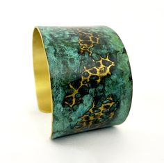 These unique, hand-formed copper and brass cuff bracelets with vibrant patinas create stunning accents to your personal style. Dress up or down- either way you'll be wearing an adornment that will turn heads, start conversations, and delight the eye of the beholder. Hammered Brass cuff with bright brass peeking through a lovely marbled green/blue patina. Please note that patina colors will look different depending on the screen/device you view them on. This is a medium cuff- see measurements bel Unique Hammered Brass Cuff Bracelet, Unique Hammered Copper Cuff Bracelet, Bronze Wearable Art Cuff Bracelet As Gift, Artisan Electroformed Cuff Bangle Bracelet, Bronze Bangle Bracelet With Patina, Artistic Patina Cuff Bracelet As Gift, Artistic Patina Cuff Bracelet Gift, Adjustable Gold Cuff Bracelet With Patina, Adjustable Patina Bangle As Gift