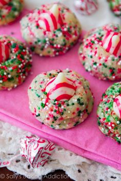 some cookies with sprinkles and candy on them