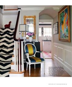 the stairs in this house are decorated with black and white stripes