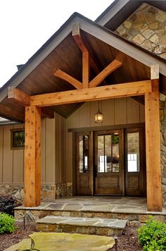 the front entrance to a home with stone steps