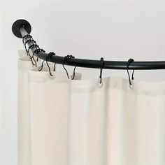 the curtain is hanging down from the rod