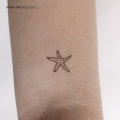 a small starfish tattoo on the wrist