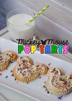 mickey mouse pop tarts with milk and sprinkles on a white plate