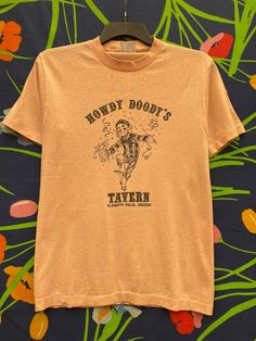 howdy doody tavern, bar, Klamath Falls, Oregon, single stage T-shirt, same in pink T-shirt with single stitch Vintage, single-stitch, t-shirt, vintage shirt, vintage streetwear, retro single stitch, vintage graphic, retro graphic print, retro print abstract graphic, band graphic, graphic t-shirt, graphic shirt,vintage graphic Vintage Short Sleeve T-shirt For Western-themed Events, Klamath Falls Oregon, Ventriloquist Doll, Howdy Doody, Stitch Tshirt, Doll Cartoon, Klamath Falls, Abstract Graphic, Cartoon T Shirt