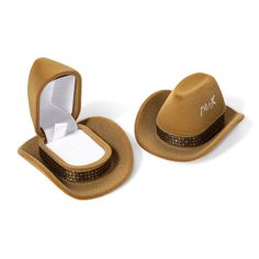 two brown hats with white box on top and one in the shape of a cowboy's hat