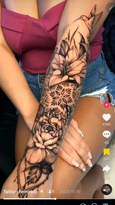 a woman's arm with flowers on it