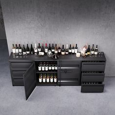 a black cabinet filled with lots of bottles