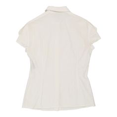 Description:Vintage white Versace short sleeve shirt, fits large.GENDER: womens CONDITION: good - small faint stain on right armpit, not visible when wearing.STYLE: short sleeve shirtERA: 1990sCOLOUR: whiteFABRIC: cotton blendNotes: Garment is labelled as an Italian size 44, and fits a women's large. Material blend is 90% cotton, 10% polyamide. Classic White Short Sleeve Top For Summer, Elegant Cotton Short Sleeve Shirt, Fitted White Short Sleeve Top, Elegant Fitted White Short Sleeve Top, White Short Sleeve T-shirt For Work, White Fitted Short Sleeve Blouse, White Short Sleeve Tops For Daywear, Versace Shorts, White Short Sleeve Shirt