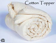 an image of a white comforter with the words cotton topper on it