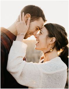 a man and woman standing next to each other with their hands on their foreheads