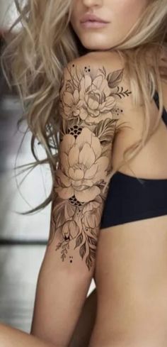 a woman with flowers on her arm and chest